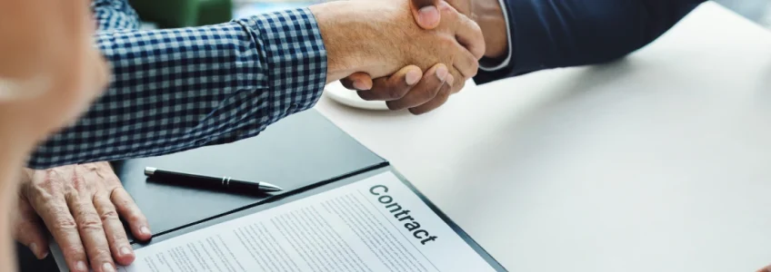Vendor Contract Management: A Complete Guide for Modern Organizations 4 two men shaking hands