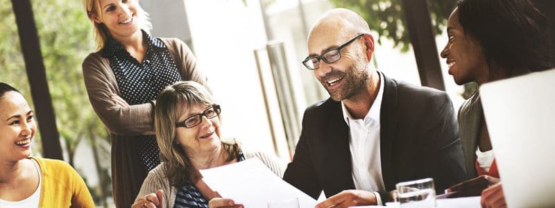 4 Benefits of Telecom Expense Management (TEM) 18 five smiling people review paperwork
