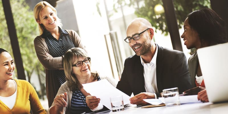 Resources 130 five smiling people review paperwork