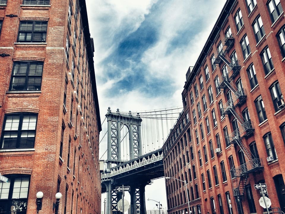 Utility Expense Management 9 bridge seen between two brick buildings